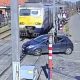 A train slammed into a car stuck on tracks in Liège after a wrong turn trapped it at a crossing—driver escaped just in time, causing chaos and commuter delays.
